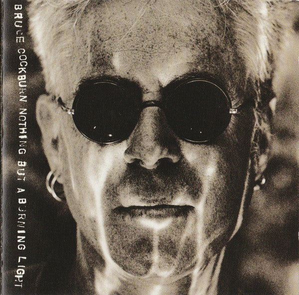 Cockburn, Bruce โ Nothing But A Burning Light (CD)(used)